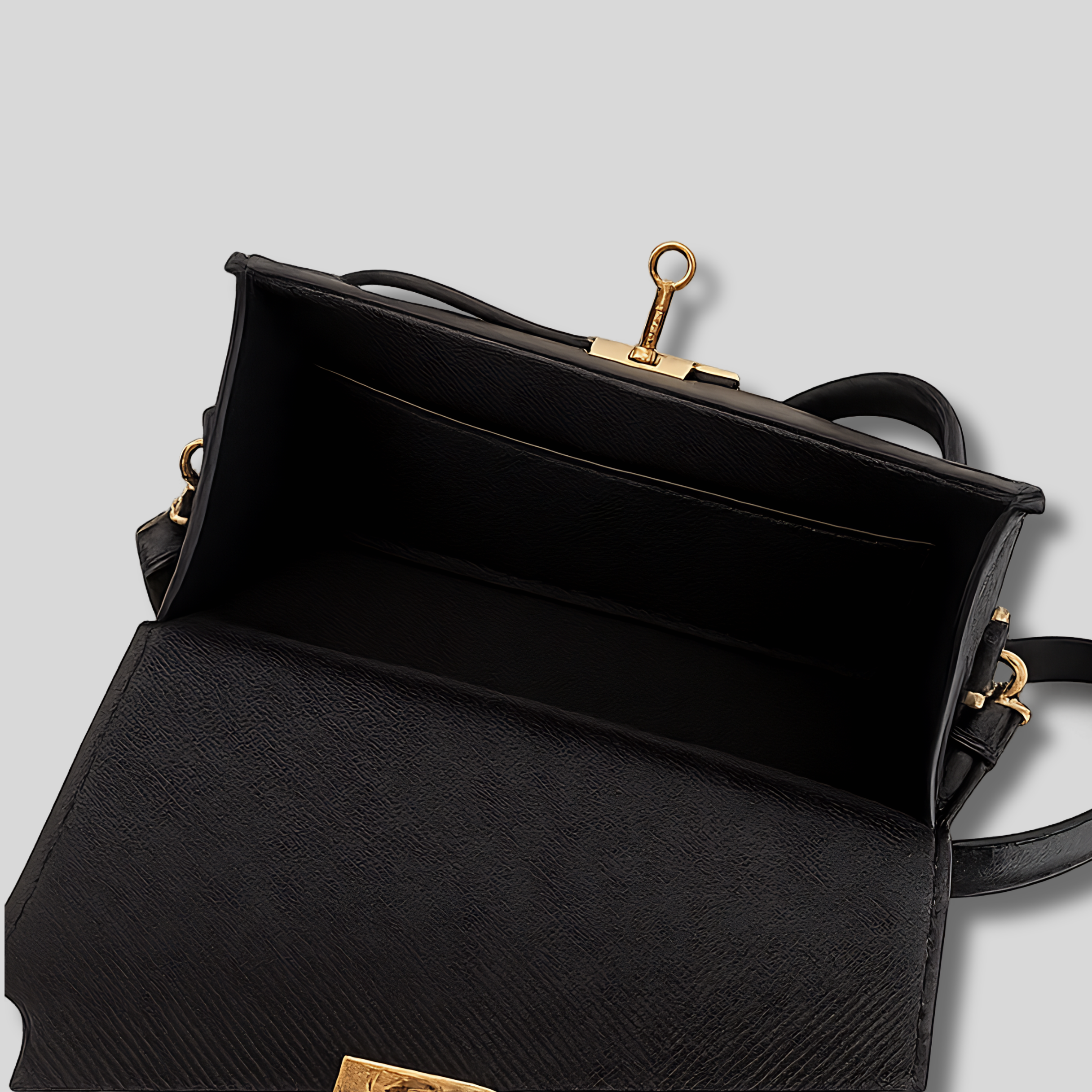 Sac bandoulière noir élégant ouvert avec intérieur spacieux et fermeture dorée vue de face