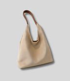 Sac cabas beige minimaliste avec anse large et silhouette fluide