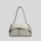 Sac bandoulière gris clair moderne avec double fermeture et silhouette structurée – vue de face