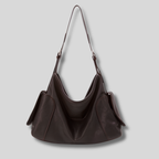 Sac Bandoulière Orélyne en cuir véritable marron foncé avec design minimaliste et grande capacité de rangement.