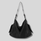 Sac Bandoulière Orélyne en cuir véritable noir avec silhouette souple et poches latérales élégantes.
