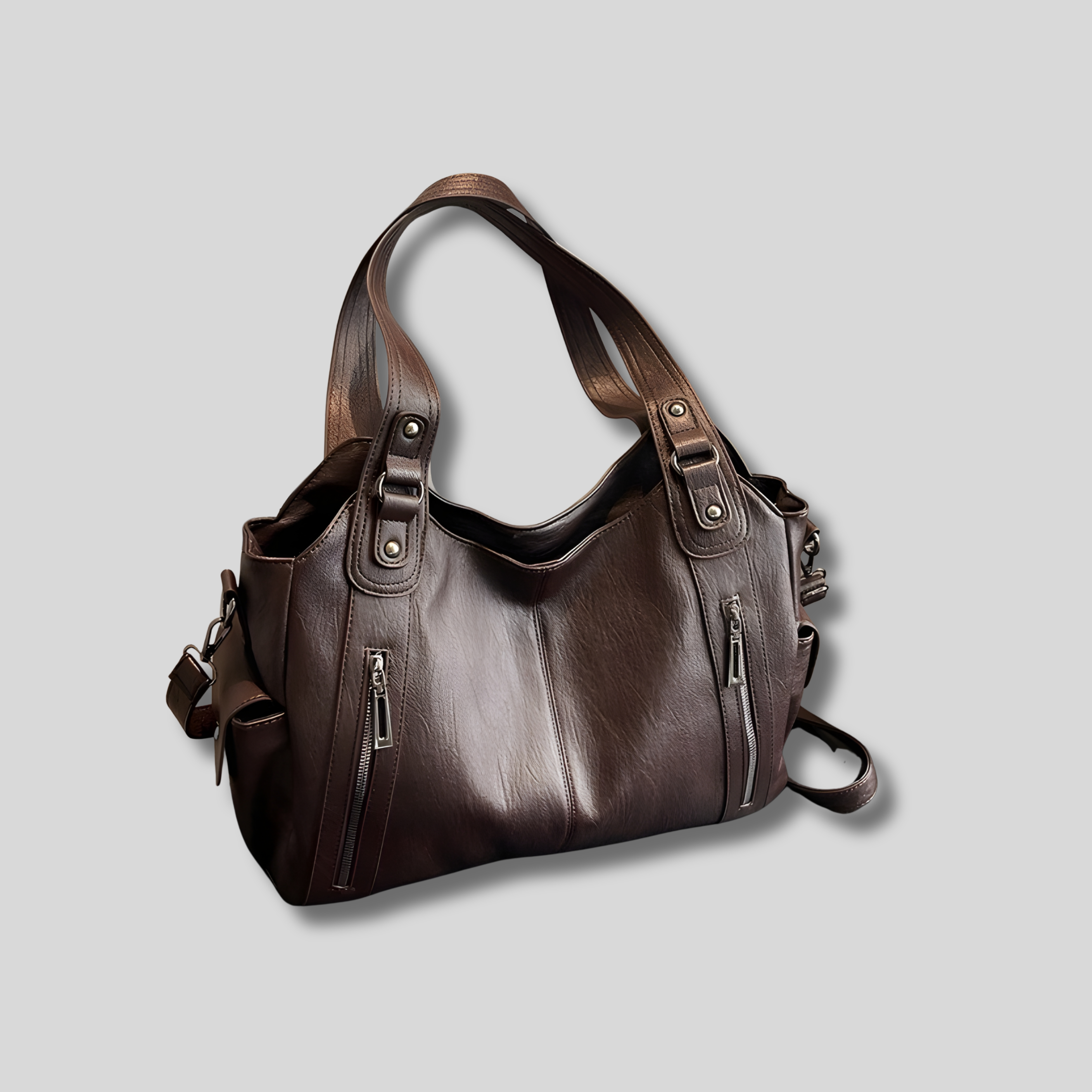 Sac à épaule marron foncé, vue de face, format spacieux avec double fermeture zippée et design structuré