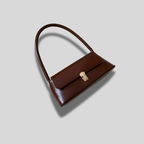 Sac baguette Éloria marron foncé, design minimaliste et élégant, porté main courte pour un style intemporel.