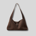 Sac Épaule Ambréa marron en cuir véritable effet daim avec design minimaliste et fermeture à boucle.