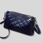 Sac épaule matelassé en cuir bleu marine avec fermetures zippées argentées
