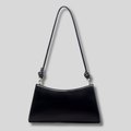 Sac épaule noir minimaliste pour femme avec bandoulière fine et finition élégante