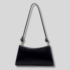 Sac épaule noir minimaliste pour femme avec bandoulière fine et finition élégante