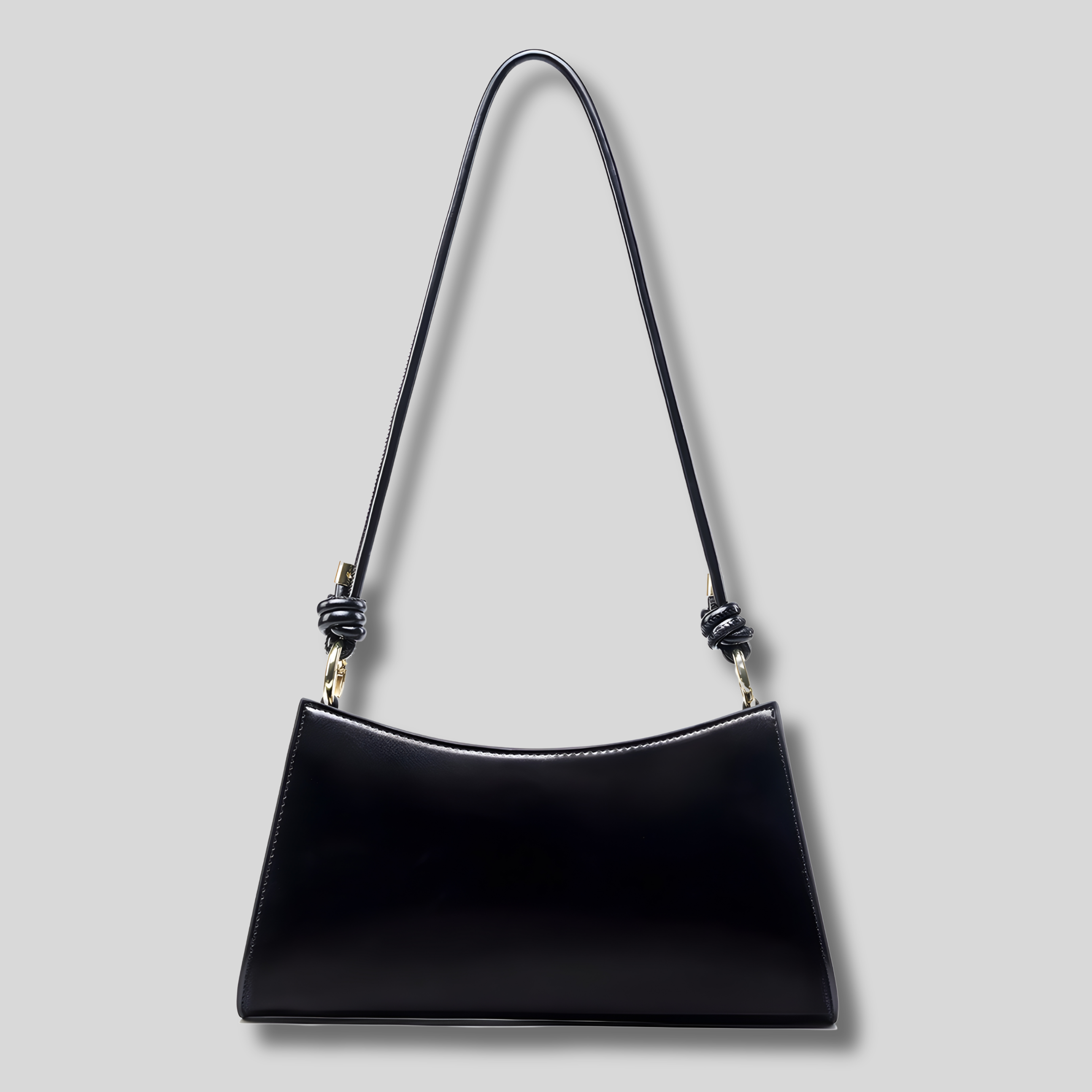Sac épaule noir minimaliste pour femme avec bandoulière fine et finition élégante