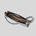 Intérieur du sac épaule avec compartiment principal et fermeture éclair dorée