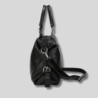 Sac cabas cuir noir vue latérale avec bandoulière ajustable