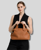 sac cuir marron femme porté à la main élégant